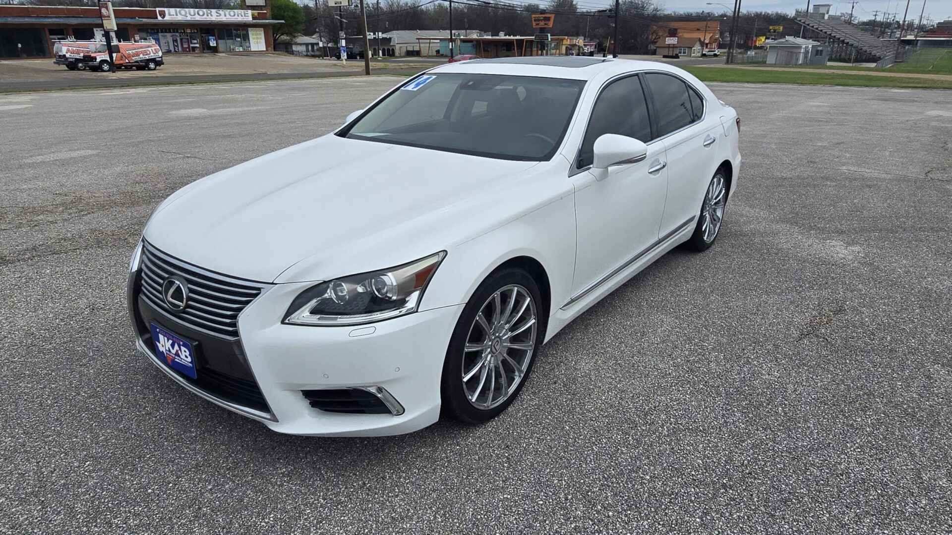 Front Exterior: 2014 Lexus CT 200h featuring the signature spindle grille and LED daytime running lights.