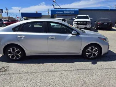 2019 Kia Forte FE side profile view highlighting its sleek aerodynamic silhouette and 15-inch efficiency-engineered wheels for our digital showroom.