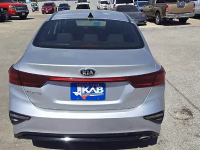Rear view emphasizing the integrated spoiler and chrome exhaust tip.