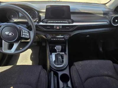 2019 Kia Forte FE interior cockpit featuring the 8-inch floating touchscreen with standard Apple CarPlay and Android Auto integration.