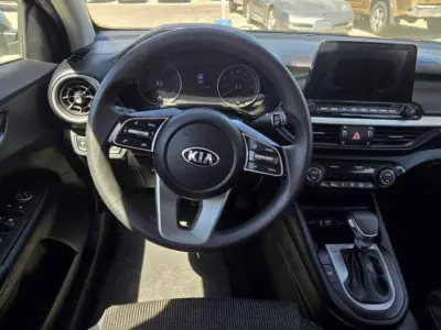 Driver cockpit detail showcasing the Drive Mode Select (DMS) button and IVT shifter.