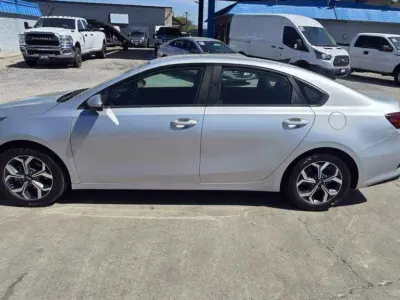 Side profile highlighting the coupe-like roofline and 17-inch alloy wheels.