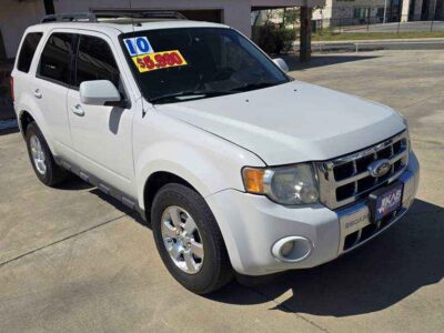 Front Profile: 2010 Ford Escape Limited Compact Crossover with chrome-accented grille and fog lamps.