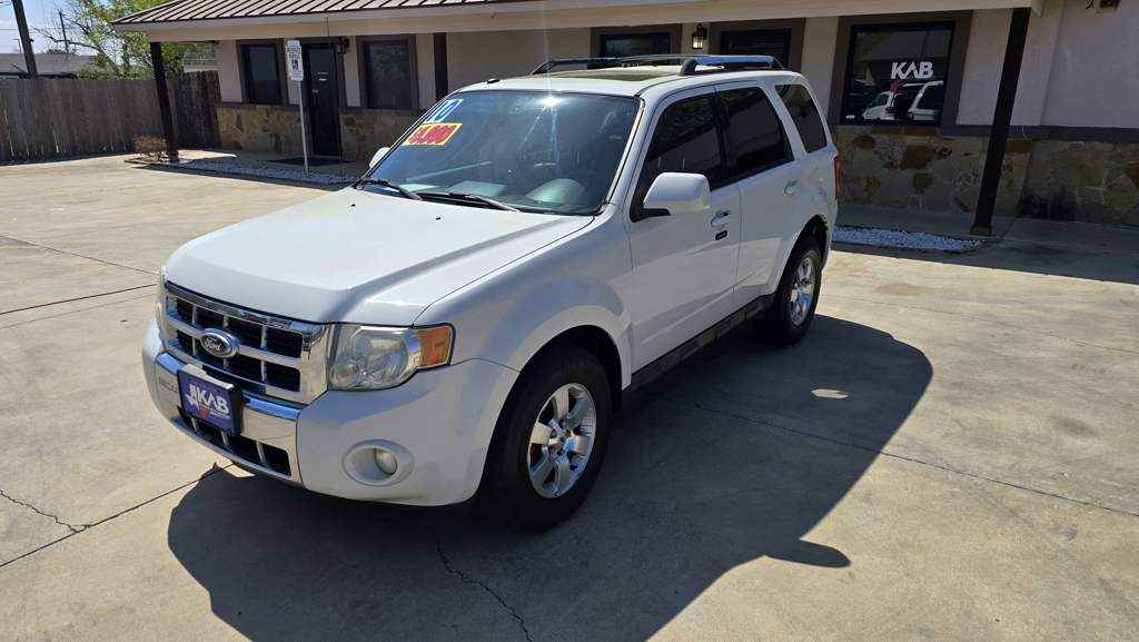 2011 Ford Escape Limited SUV in White featuring a 3.0L V6 Flex Fuel engine and chrome roof rails at BuskoCars.