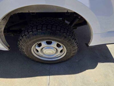 Wheel Detail: 17-inch silver steel wheels with heavy-duty ventilated disc brakes at BuskoCars.