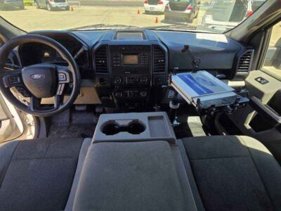 Interior Cabin: Driver-focused XL cabin with durable cloth upholstery and integrated productivity screen.