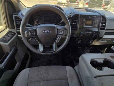 Interior cockpit featuring the Medium Earth Gray cloth seats and functional dash layout.