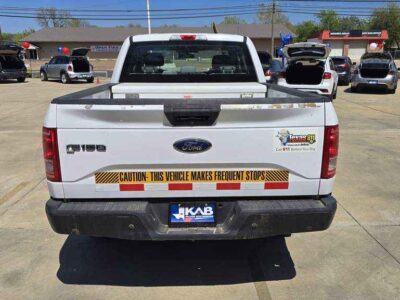 Rear Profile: Rear view showing the high-strength aluminum-alloy bed and reinforced Class IV hitch.