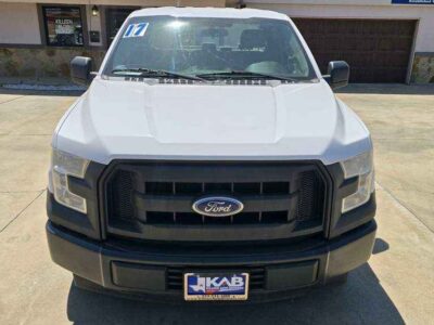 Front Profile: 2017 Ford F-150 XL with black carbon-insert grille and impact-resistant front fascia.