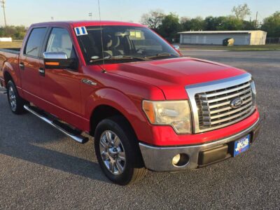 Front view of the 2011 Ford F-150 Lariat in Sterling Gray Metallic, featuring the Lariat Chrome Package grille for BuskoCars.