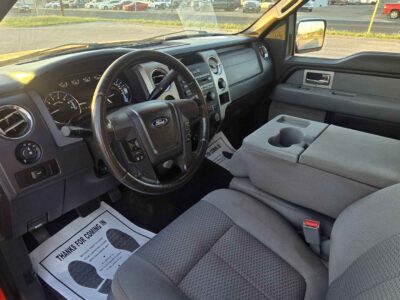 Interior cockpit view featuring the Black Leather-Trimmed heated and cooled bucket seats.