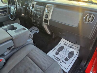 Interior cockpit view featuring the Black Leather-Trimmed heated and cooled bucket seats.