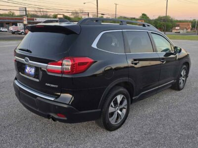 Side profile showcasing the roof rails and aerodynamic lines.