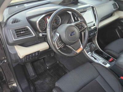 Interior cockpit view featuring the StarLink infotainment and 8-passenger seating.