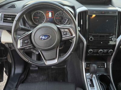 Interior cockpit view featuring the StarLink infotainment and 8-passenger seating.