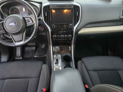Interior cockpit view featuring the StarLink infotainment and 8-passenger seating.