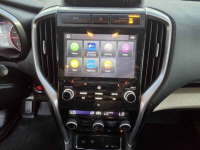 Interior cockpit view featuring the StarLink infotainment and 8-passenger seating.