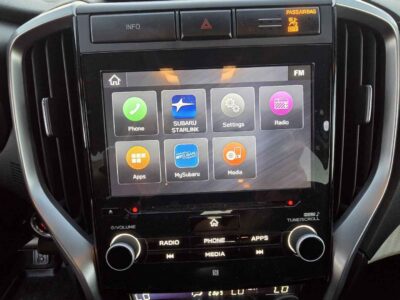Interior cockpit view featuring the StarLink infotainment and 8-passenger seating.