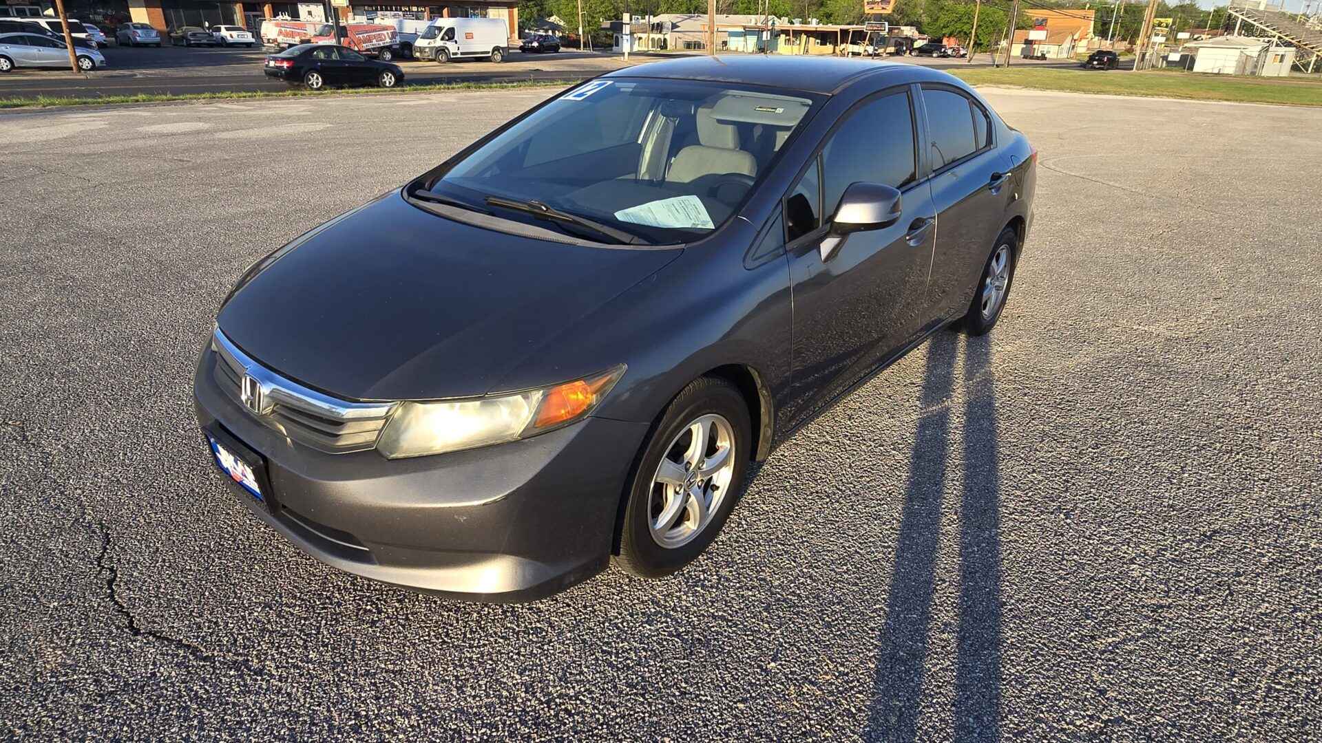2012 Honda Civic Natural Gas Sedan in White featuring a 1.8L i4 engine and fuel-efficient CNG technology at BuskoCars.