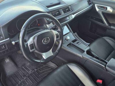 Interior Cabin: Luxury-appointed compact cabin featuring executive aesthetics and hybrid-system interface.