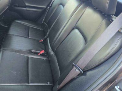 Interior Cabin: Luxury-appointed compact cabin featuring executive aesthetics and hybrid-system interface.