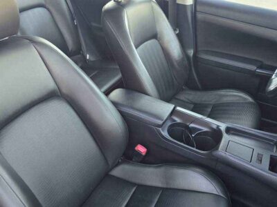 Interior Cabin: Luxury-appointed compact cabin featuring executive aesthetics and hybrid-system interface.
