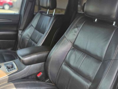 Interior Cabin: Premium Limited trim interior with Black/Light Frost Beige accents, heated leather seating, and Uconnect interface.