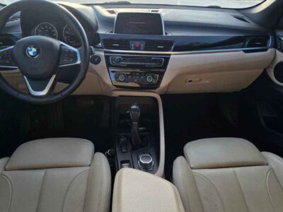 Premium black luxury interior front cabin seats environment inside 2018 BMW X1 sDrive28i