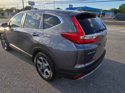 2017 Honda CR-V EX side exterior profile highlighting clean Modern Steel Metallic finish and factory aluminum wheels